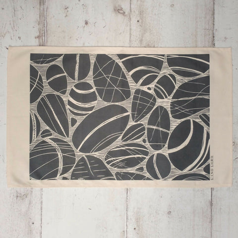 Cotton Tea Towel with Pebbles on the Shore Lino Print