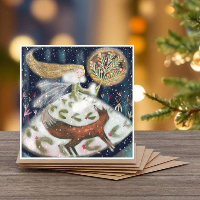 A set of 6 Christmas note cards with kraft envelopes by Alli Conner with a woman and fox design 