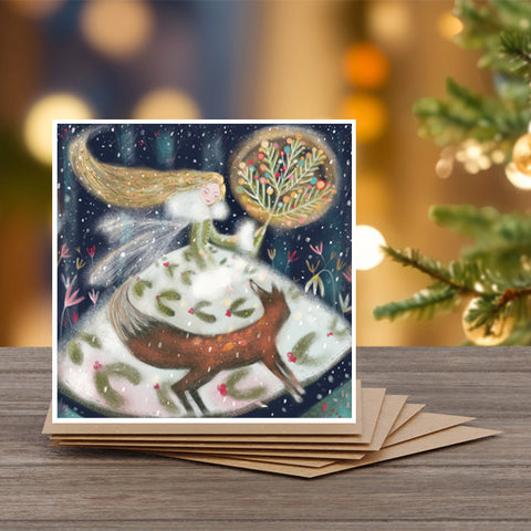 A set of 6 Christmas note cards with kraft envelopes by Alli Conner with a woman and fox design 