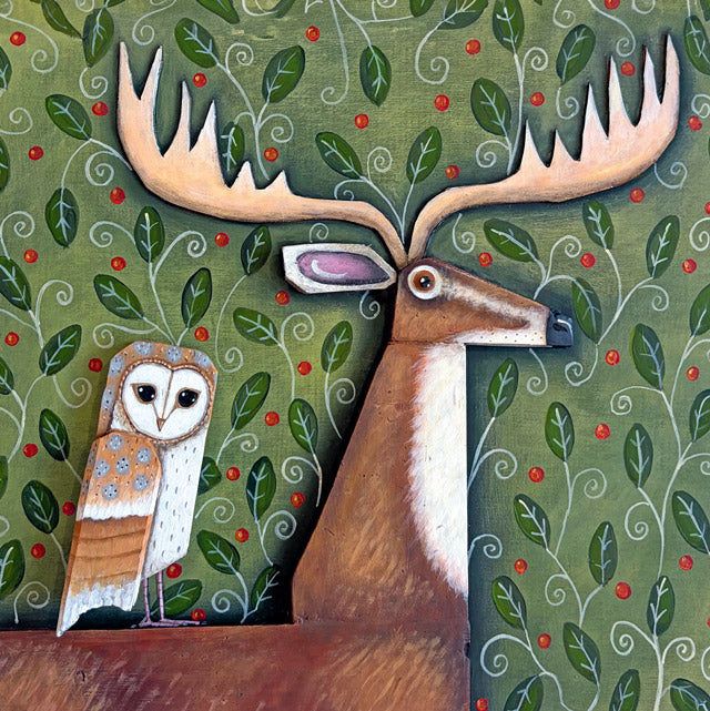 A fine art greeting card by painter Claire Brierley, featuring a large brown deer with large antlers and a small owl on a decorated green background with red berries.