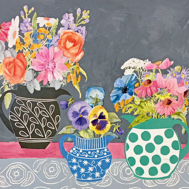 A colorful still life painting of flowers arranged in three patterned ceramic pitchers against a dark gray background, with a pink tabletop and gray patterned fabric at the bottom.