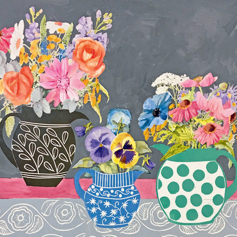 A colorful still life painting of flowers arranged in three patterned ceramic pitchers against a dark gray background, with a pink tabletop and gray patterned fabric at the bottom.