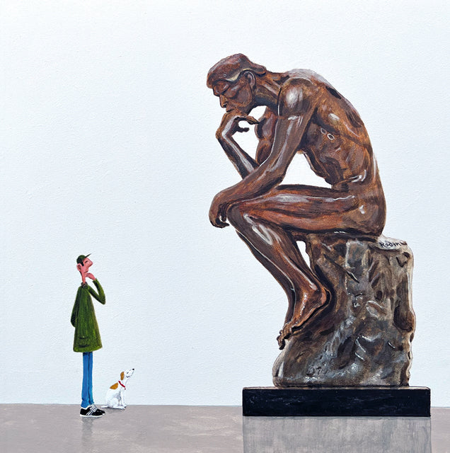 Bronze sculpture of a thinker with a small figure and dog looking up at it on a white background. After Auguste Rodin.