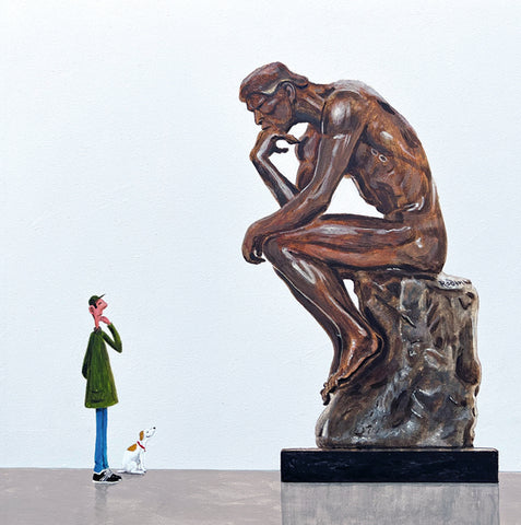 Bronze sculpture of a thinker with a small figure and dog looking up at it on a white background. After Auguste Rodin.