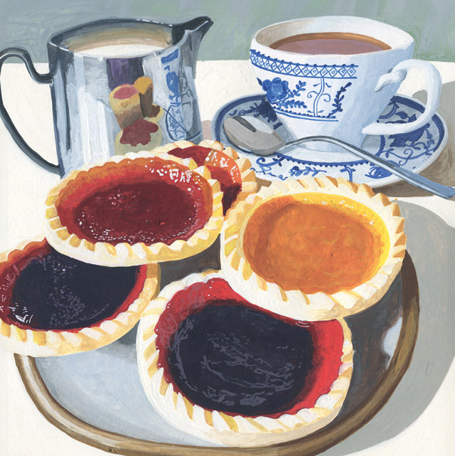 A still life painting of baked tart pies with red and dark jam, a blue-and-white teacup and saucer with tea, a metal milk or cream pitcher, and a spoon on a tabletop.