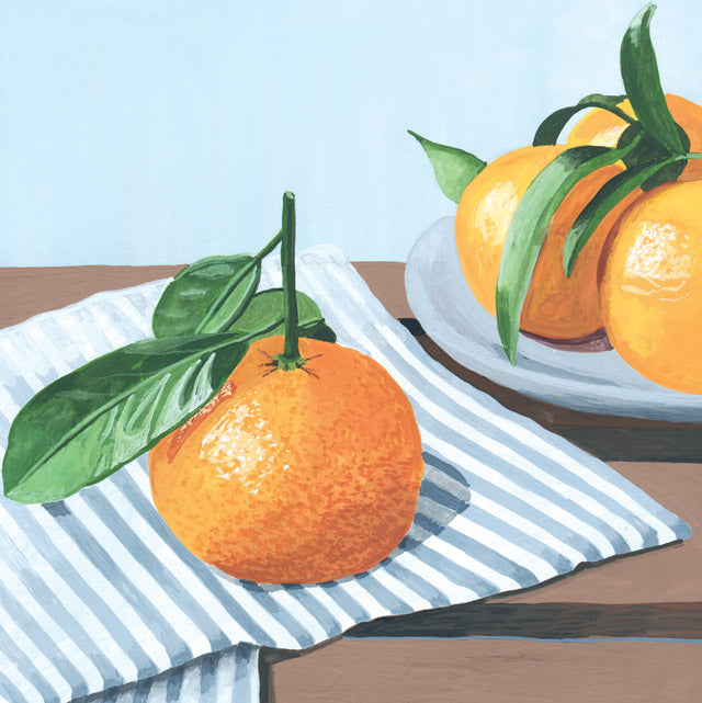 A still life painting of oranges with green leaves, one prominently displayed on a blue and white striped cloth on a wooden table, with more oranges on a plate in the background.