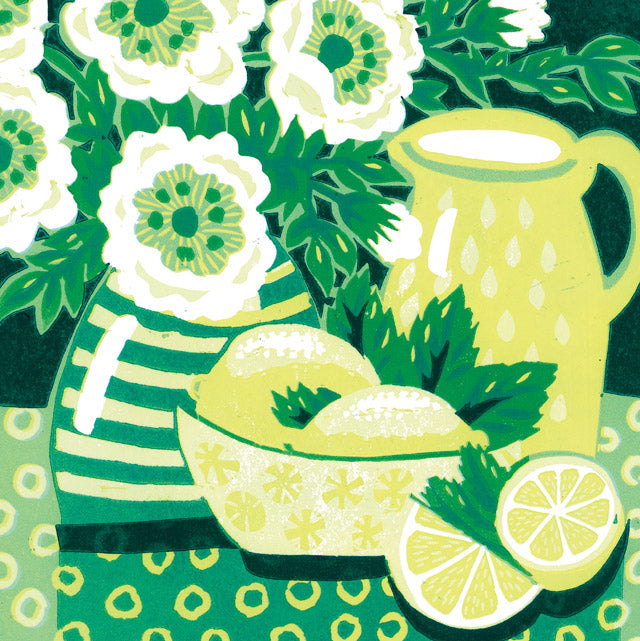 A lino print still life image featuring a pale yellow pitcher, a bowl of lemons with mint leaves, and white flowers with green centers on a patterned green background.