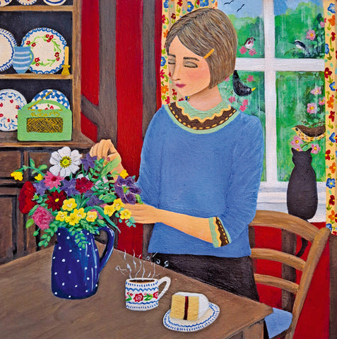 Woman arranging flowers in a kitchen with a cup of coffee and cake on the table. A fine art greeting card by painter and printmaker Marcella Cooper.