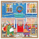 A square illustrated print or card showing a snowy Christmas storefront with the sign 'Book Nook,' decorated with a wreath, colorful windows, and two people walking in front.