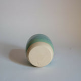 Ceramic beaker / budvase glazed in shades of turquoise and pale green
