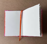 Handmade A5 hardback sketchbook containing deckle edge cotton rag paper