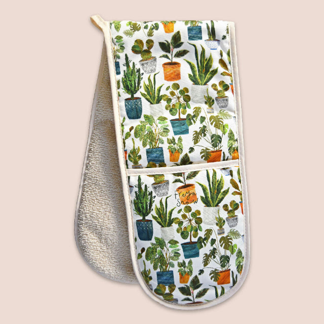 A double-sided oven mitt with a white background and a colorful pattern of potted houseplants on the exterior.