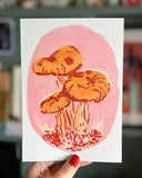 Pink-mushrooms-a5-print-in-hand-scale
